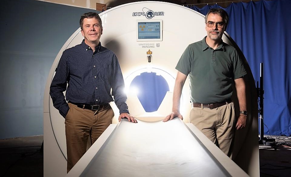Project leaders Professors Simon Cherry and Ramsey Badawi next to the EXPLORER mock-up at UC Davis Health